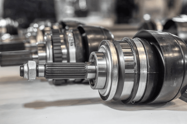 CV joint axle replacement parts at an auto repair shop