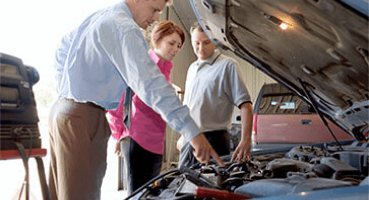 A Meineke Car Care Expert assisting customers 